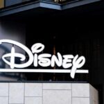 EXIT RUMORS Rock Disney Disney logo displayed on a modern building