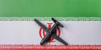 A model airplane placed on the Iranian flag
