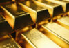Close-up of stacked gold bars with inscriptions