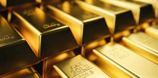 Close-up of stacked gold bars with inscriptions