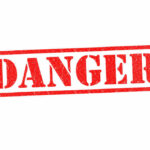 Red danger stamp on white background