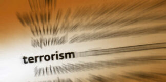 Blurred text with the word 'terrorism' in focus