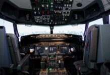 Interior view of an airplane cockpit with various instruments and controls