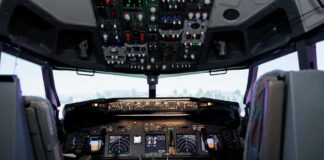 Interior view of an airplane cockpit with various instruments and controls