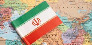 Iranian flag placed on a map of the Middle East