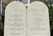 Stone tablets displaying the Ten Commandments in engraved text