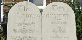 Stone tablets displaying the Ten Commandments in engraved text