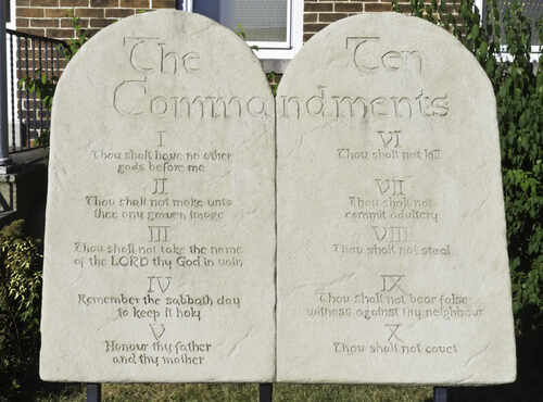 Stone tablets displaying the Ten Commandments in engraved text