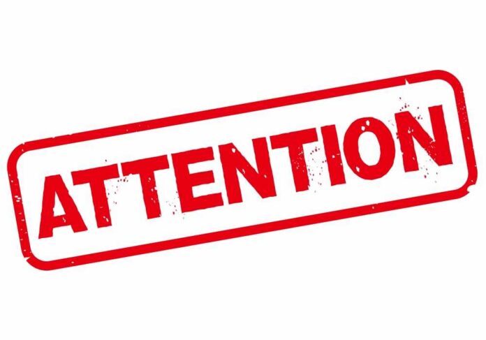 Red stamp with the word 'ATTENTION' in bold letters