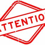 Red attention sign with the word 'ATTENTION' in bold letters