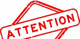 Red attention sign with the word 'ATTENTION' in bold letters