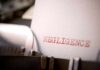 Close-up of a typewriter with the word 'NEGLIGENCE' typed on a sheet of paper