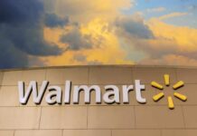 Walmart sign against a cloudy sky