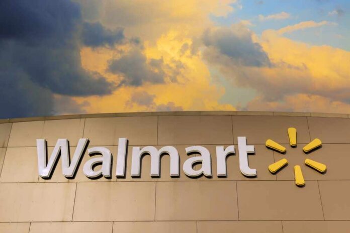 shutterstock_2495231303.jpg Walmart sign against a cloudy sky