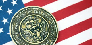 Navy Department seal on an American flag background
