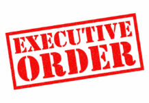 Red stamp reading executive order