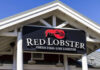 Sign for Red Lobster restaurant displaying fresh fish and live lobster