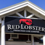 Red Lobster Restarts Promotion That Triggered Collapse Sign for Red Lobster restaurant displaying fresh fish and live lobster