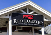 Sign for Red Lobster restaurant displaying fresh fish and live lobster