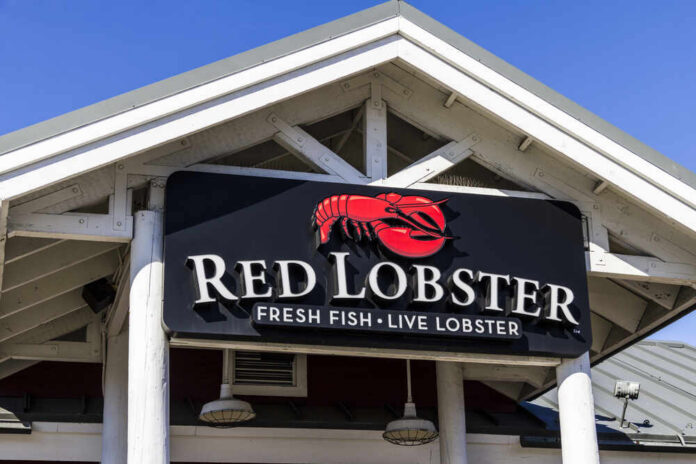 shutterstock_582096133.jpg Sign for Red Lobster restaurant displaying fresh fish and live lobster