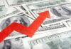 A red arrow indicating growth over scattered hundred dollar bills