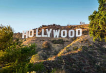 Celebrity Helper Exposed in Fatal Addiction Scandal Hollywood sign on a sunny hillside.