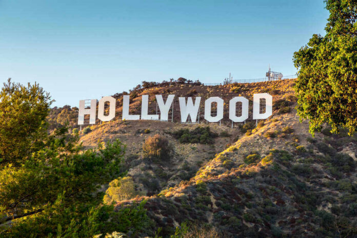 shutterstock_114467512 Hollywood sign on a sunny hillside.