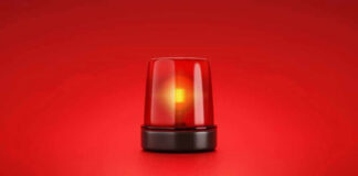 Red emergency light on solid red background.