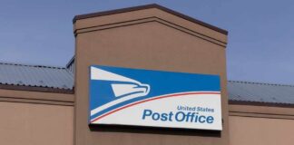 Exterior view of a United States Post Office building with a prominent sign