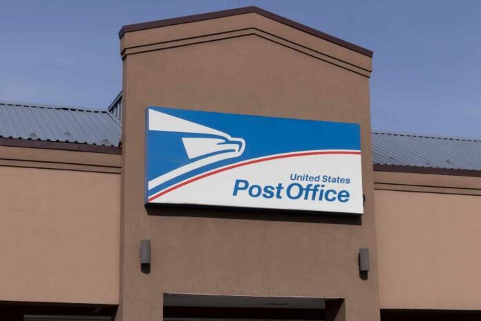 shutterstock_2149870097.jpg Exterior view of a United States Post Office building with a prominent sign