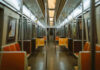 Subway Surfing Tragedy: Teen Falls to Death Empty subway train with orange seats.