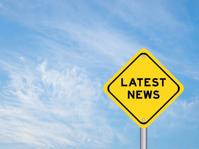 Yellow sign with text Latest News on sky background