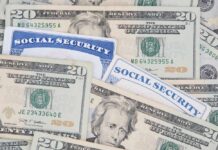 HUGE Social Security Payment Increase Coming? A collection of twenty-dollar bills and social security cards