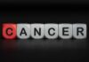 Brutal Cancer Ends NBA Pioneer’s Fight Blocks spelling the word 'CANCER' with one block in red