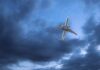 Unusual Scare Forces Passenger Jet Detour! An airplane flying through a cloudy sky