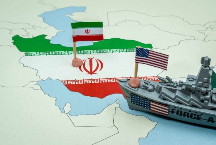 United,States,And,Iran,National,Flags,On,A,Geopolitical,Map A map of Iran with flags of Iran and the United States and a toy military ship