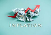 Inflation Surging: Energy Costs Hammering Americans Crumpled dollar bills with a red upward arrow and the word 'INFLATION'