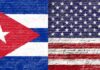 Cuban and American flags painted on a brick wall