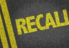 RECALL: Brake Glitch On 421,000 Vehicles Yellow 'RECALL' text on a dark asphalt surface