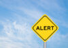 THESE Coffee Makers EXPLODE — Burn Alert! Yellow alert sign against a blue sky