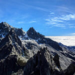 Vanished In Tahoe’s Granite Maze Snowy mountain peaks under clear blue sky.