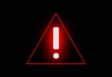 Red warning triangle with exclamation mark on black background