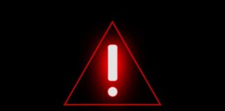 Red warning triangle with exclamation mark on black background