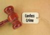 VIDEO: Judge BOOTS Serial Killer From Court A wooden gavel next to a tag that reads 'Confess Crime'