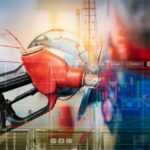 Stocks Party, Pump Pain Might Linger Gas pump with financial data overlay and oil refinery in the background