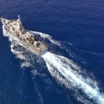 Evidence-Free Killings At Sea? Aerial view of a naval ship navigating through the ocean