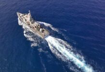 Evidence-Free Killings At Sea? Aerial view of a naval ship navigating through the ocean