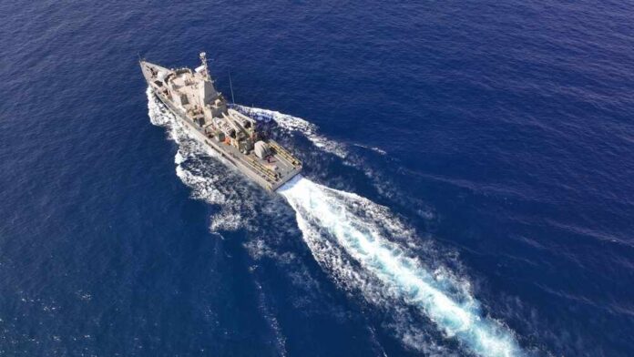 Aerial,Drone,Photo,Of,Armed,Navy,Patrol,Ship,Cruising,Deep Aerial view of a naval ship navigating through the ocean