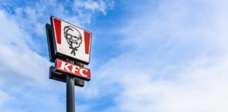 KFC restaurant sign against a blue sky