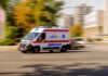 VIDEO: Hospital Turns War Zone — Deadly Shooting Ambulance van with flashing lights speeding through a city street